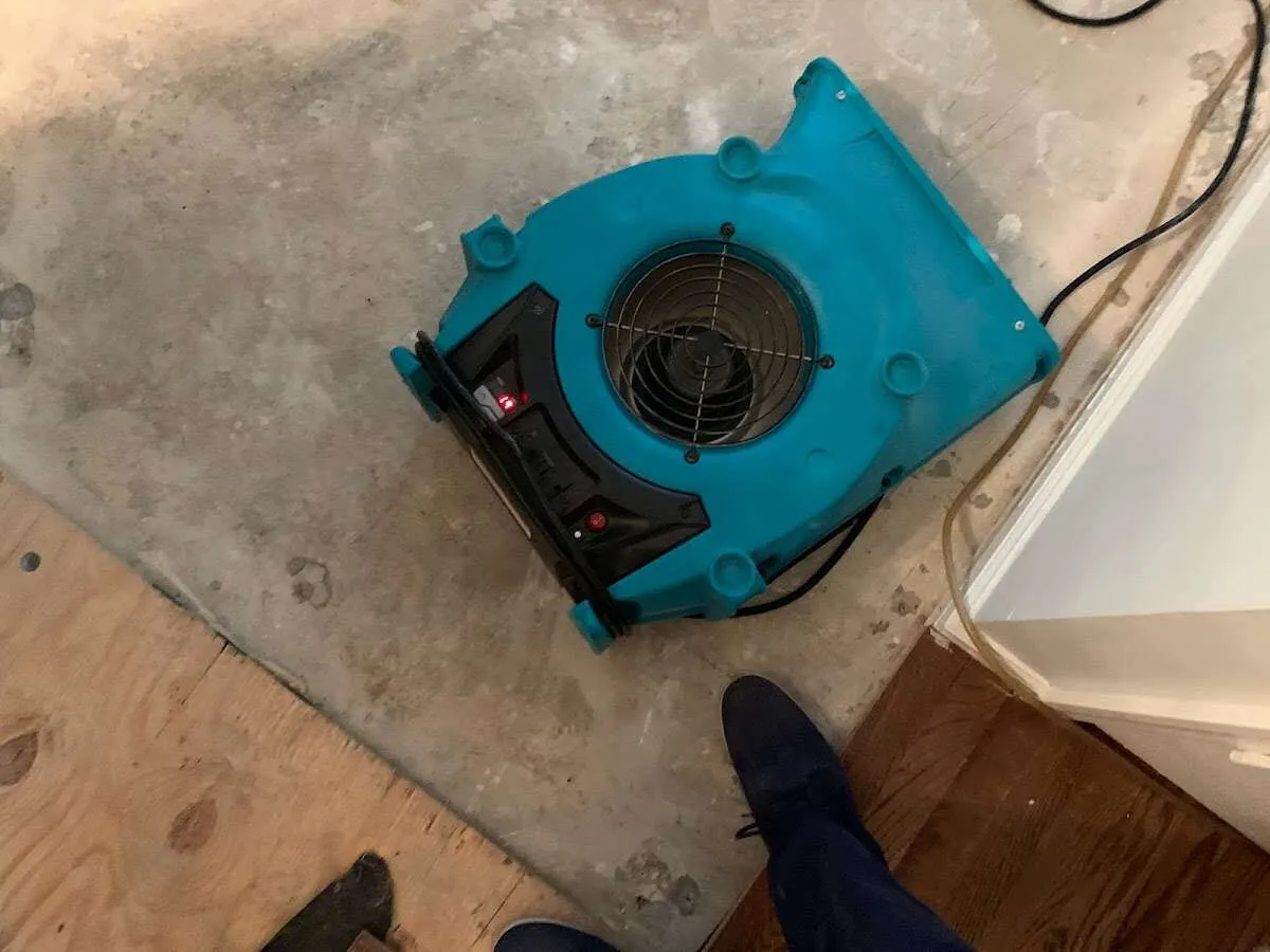 Air mover drying subfloor during Leak Detection & Repair in Weatherford